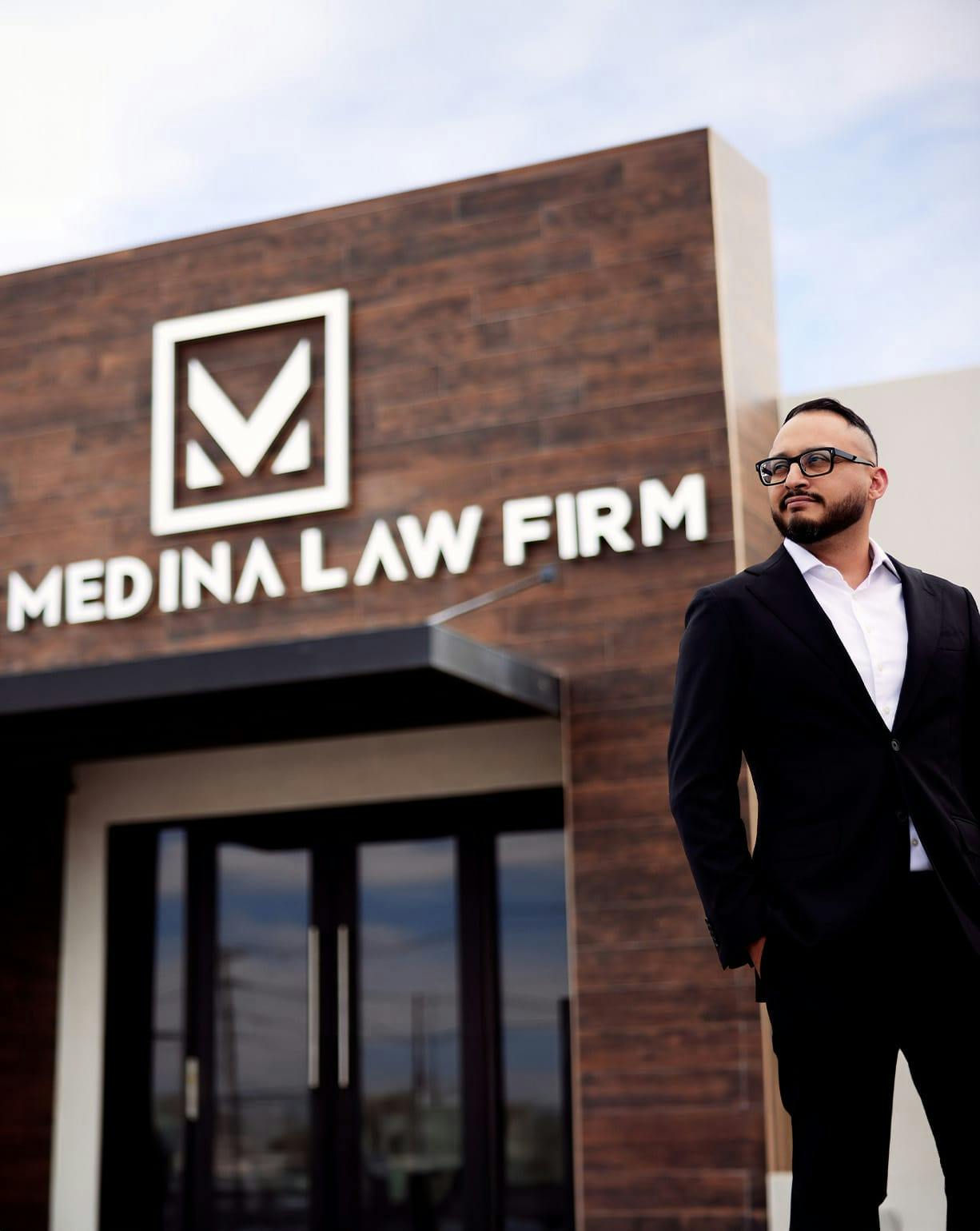 Israel Medina in front of law firm