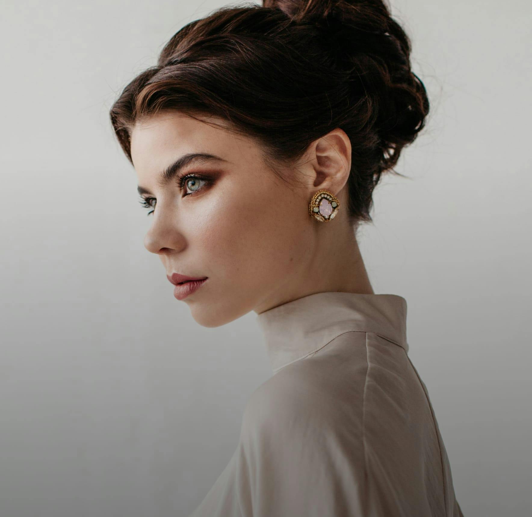 woman wearing glamorous makeup wearing her hair in an updo