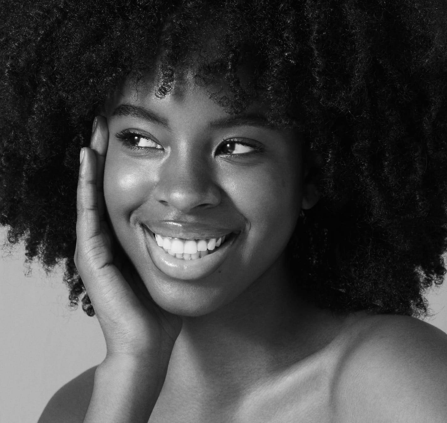 beautiful woman with an afro smiling