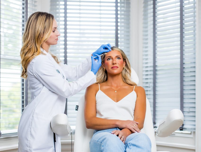 nurse with client injecting botox