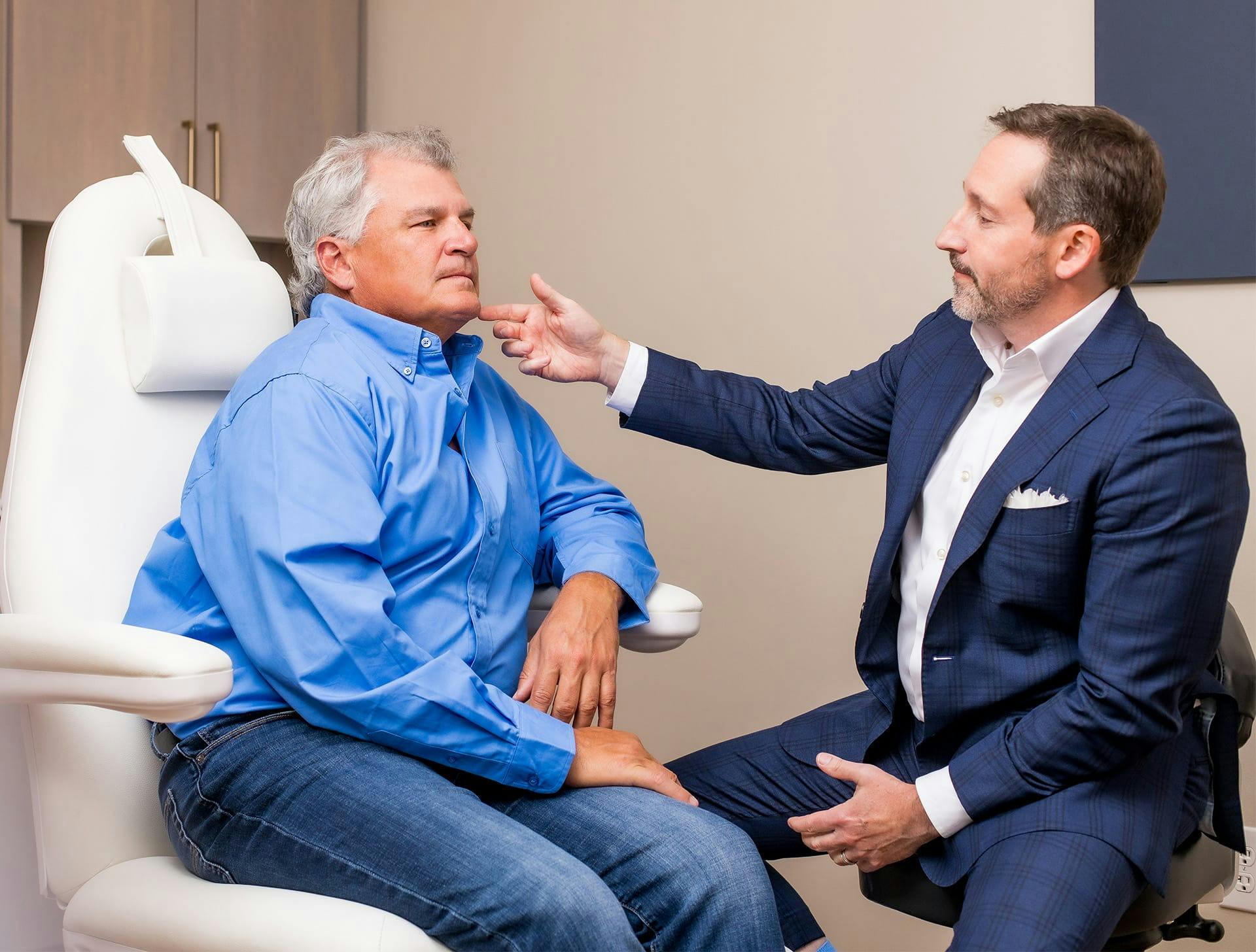 Dr. Morgenstern with a male client sitting in chairs