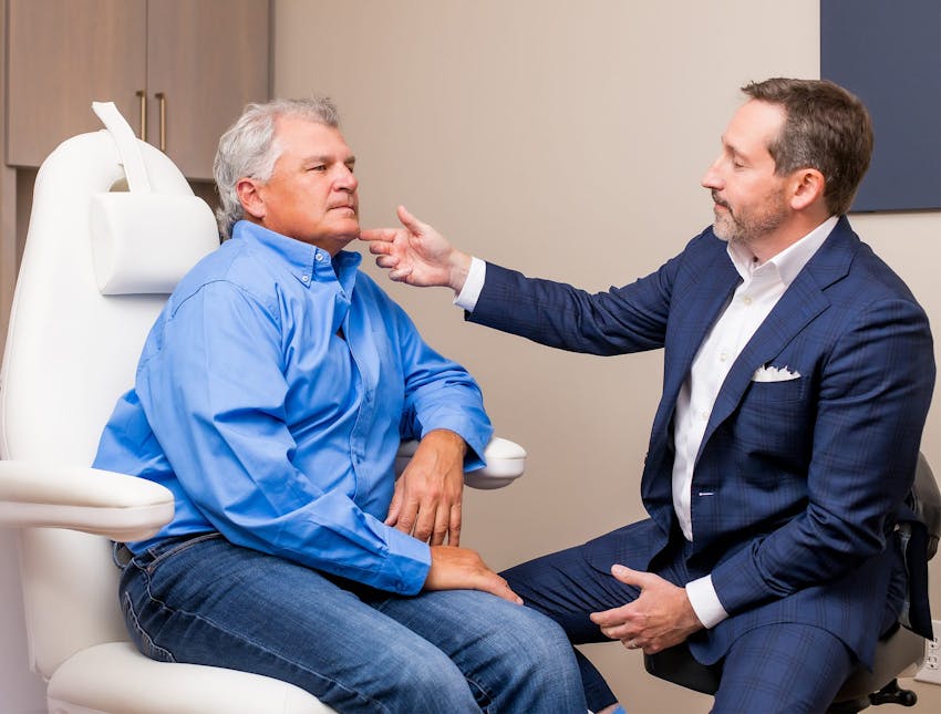 Dr. Morgenstern with a male client sitting in chairs