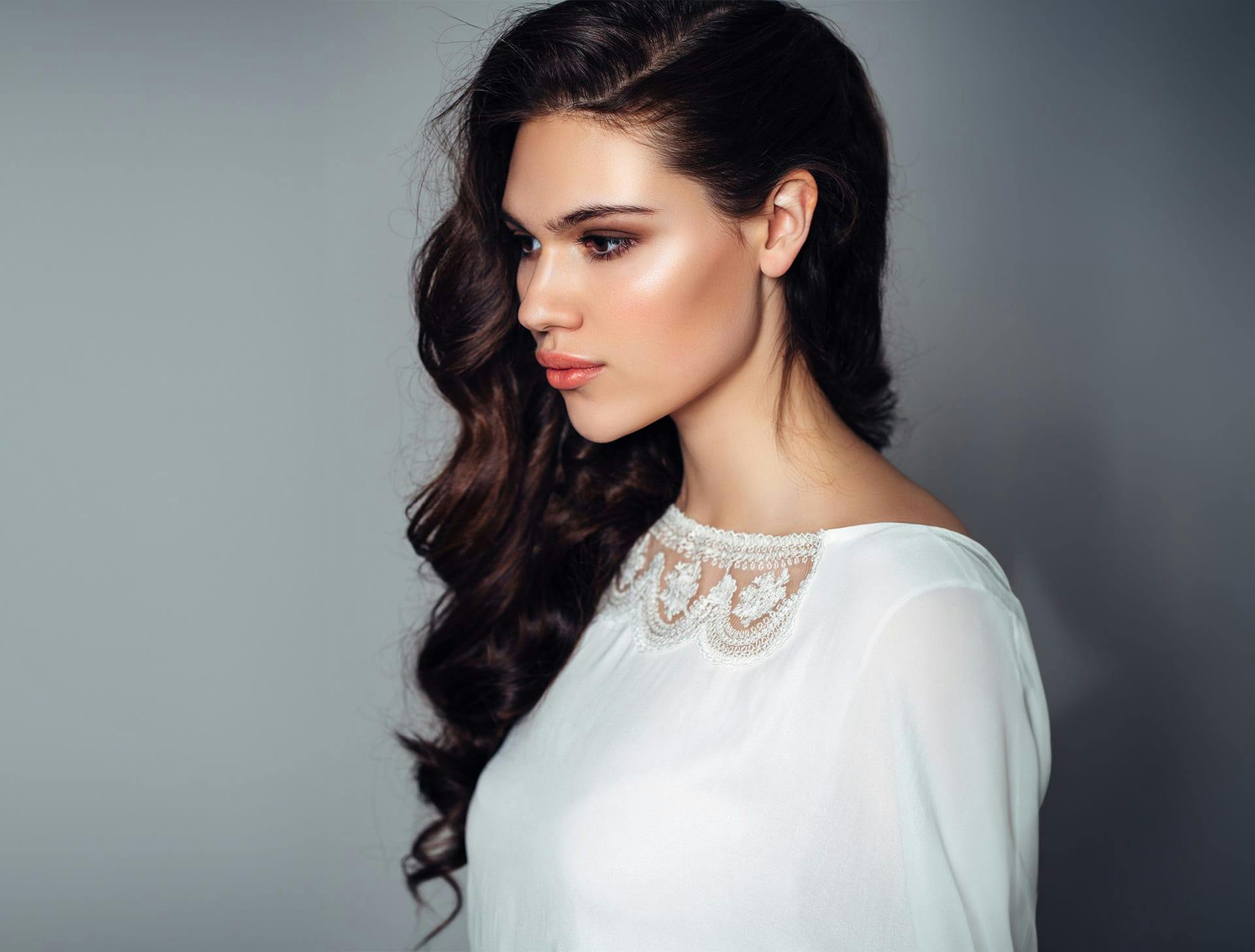 woman in white dress looking to the left