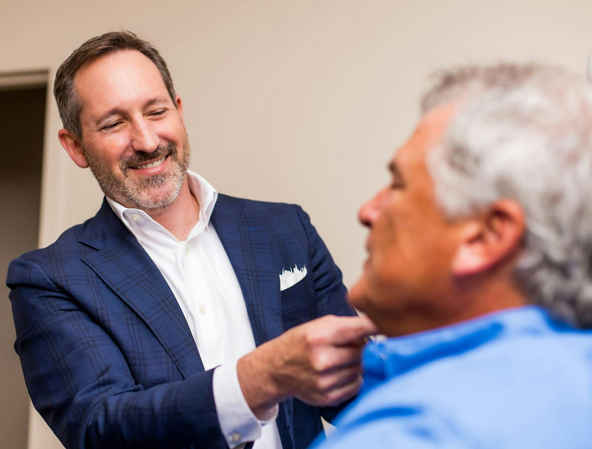 Dr. Morgenstern looking at older mans face