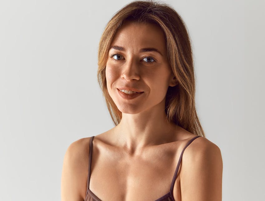 woman with brown bra looking forward