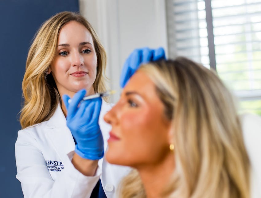 nurses injecting into client's temple