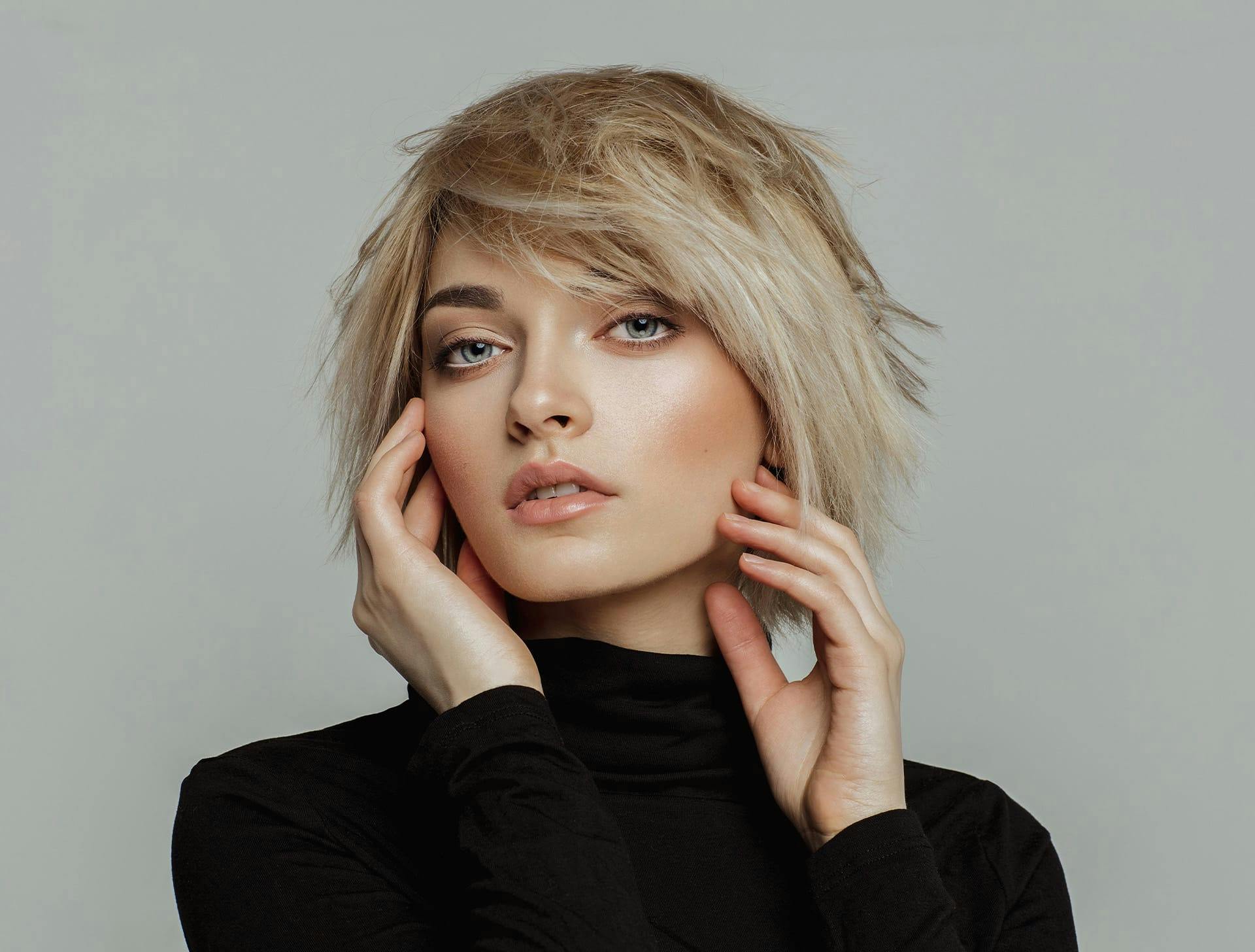 woman with short blonde hair in turtle neck