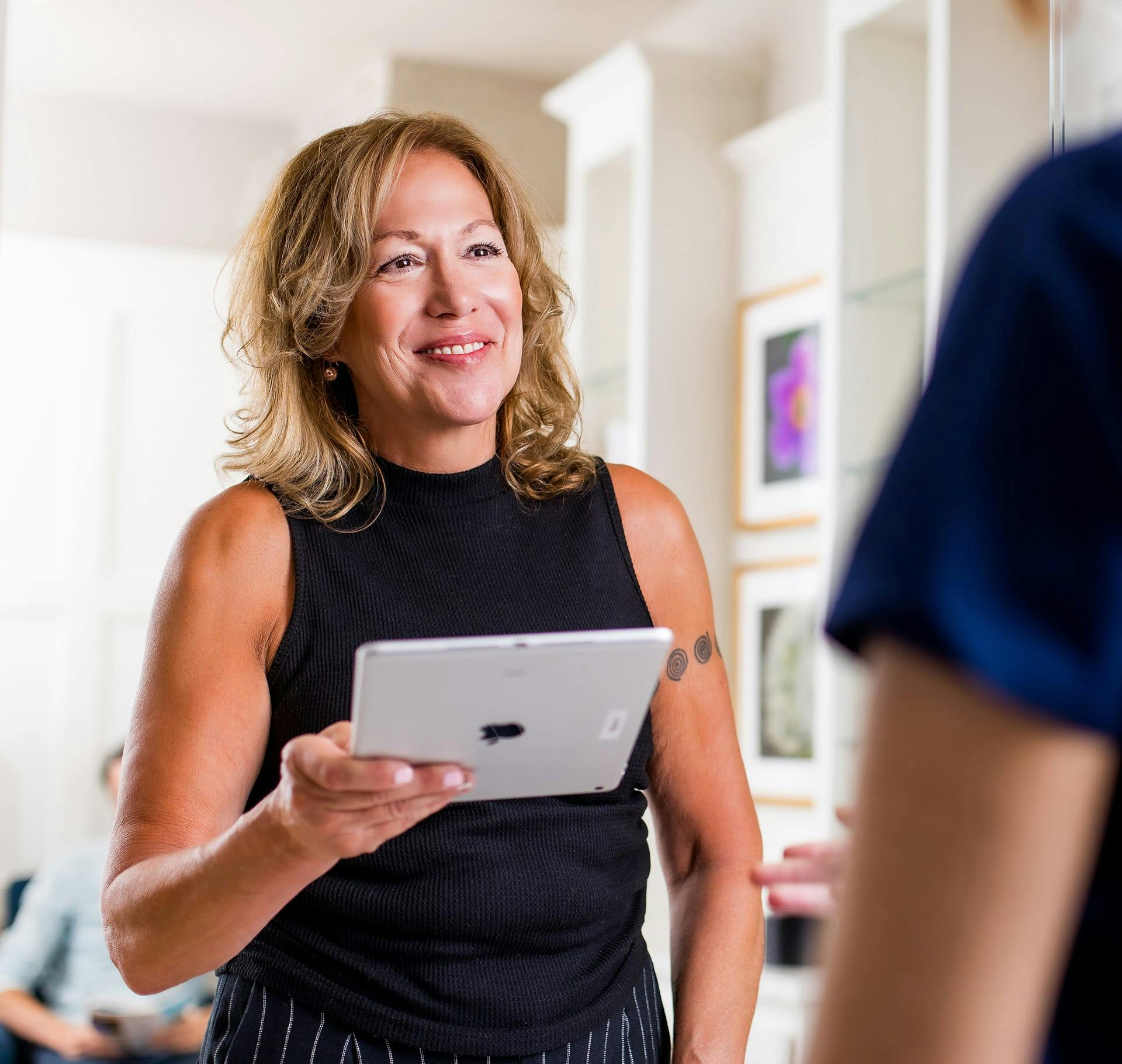 woman holding an ipad