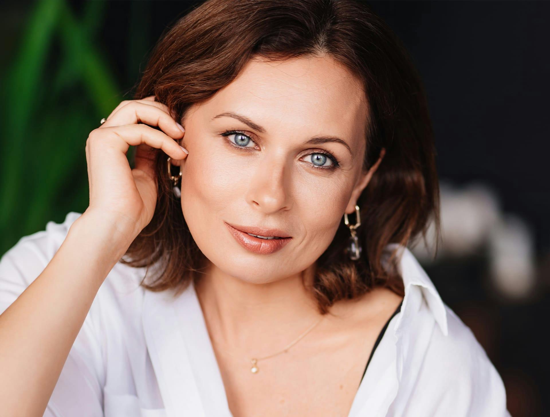 woman with short brown hair and blue eyes