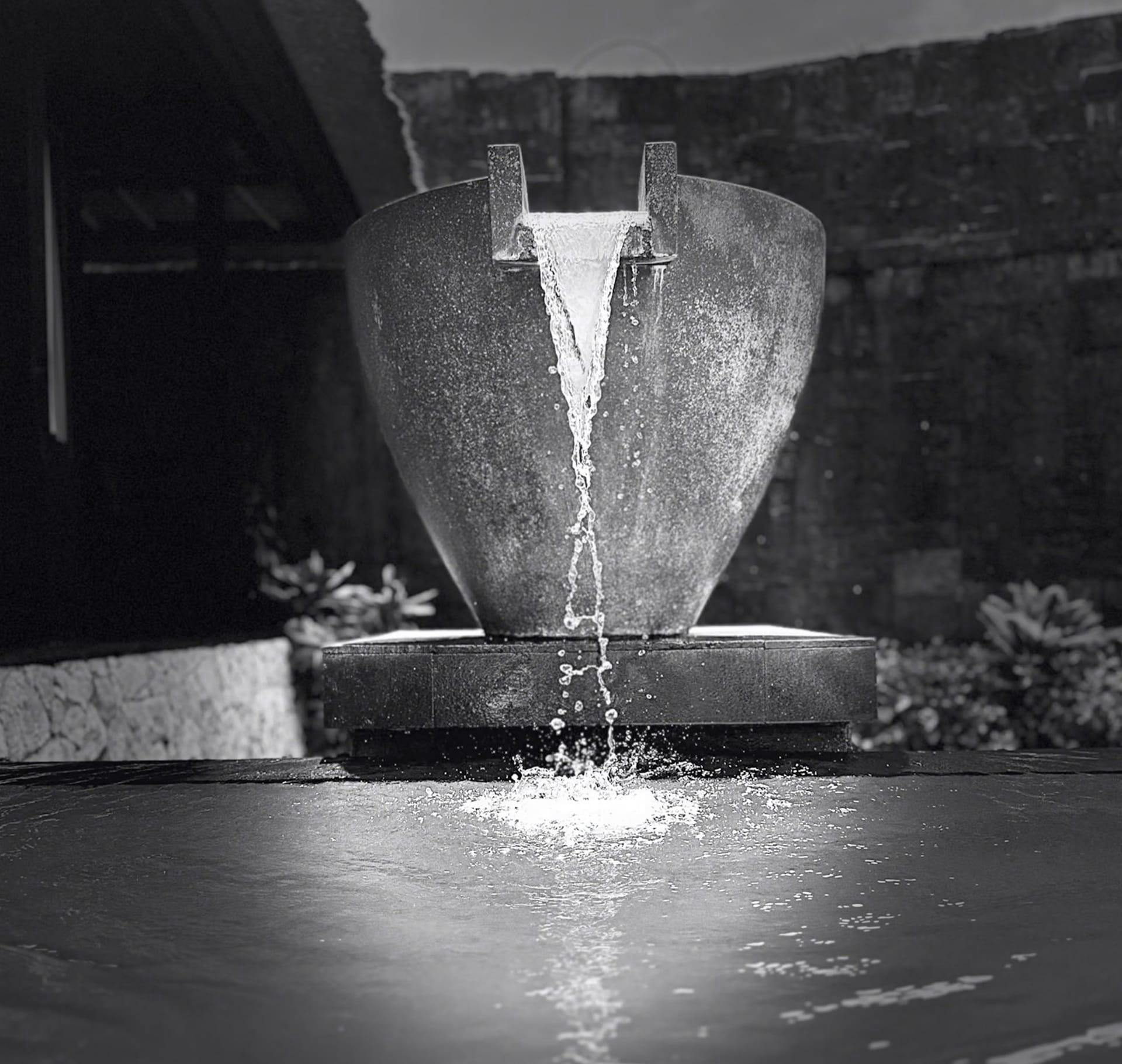 greyscale of fountain flowing