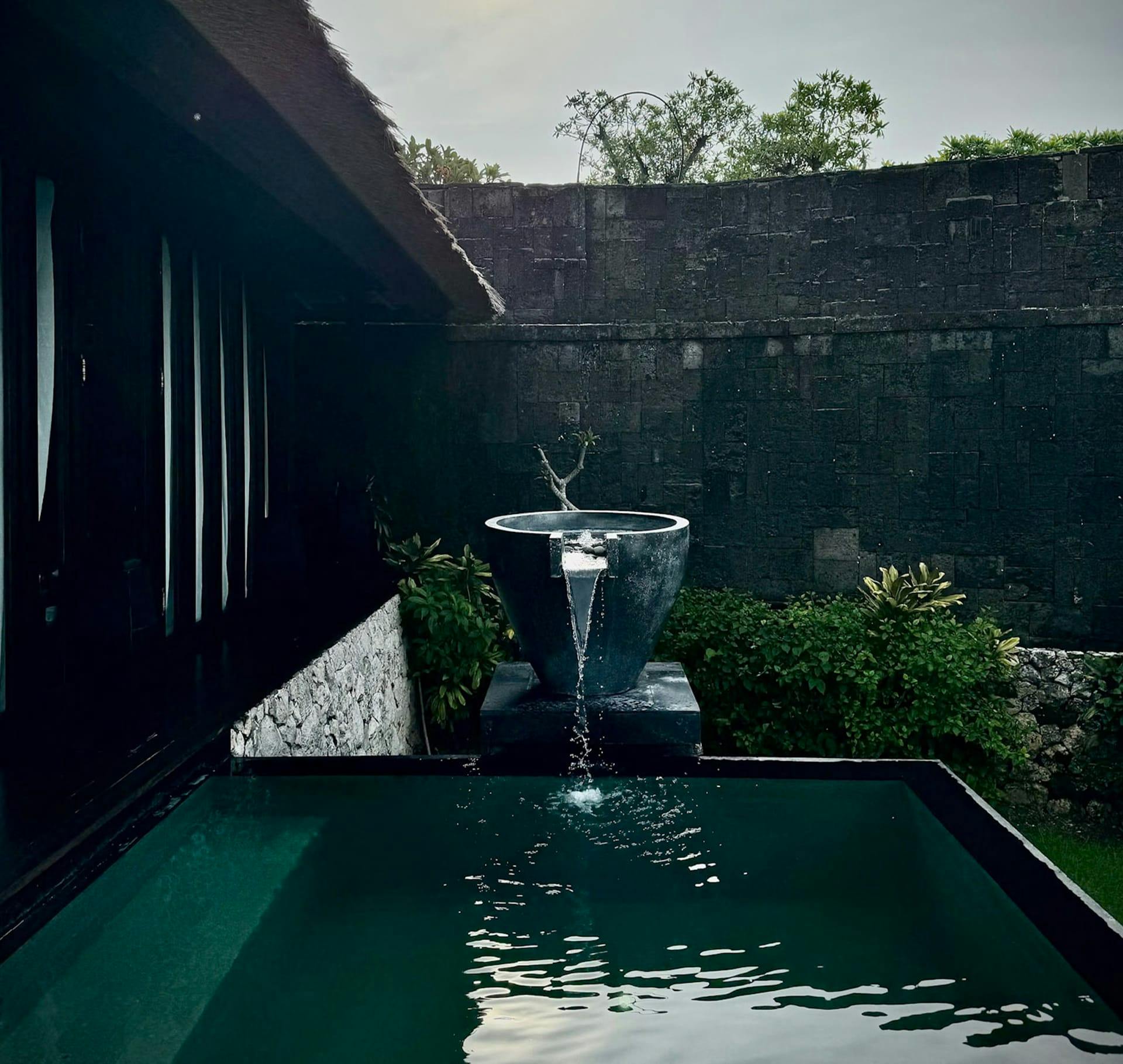 pool with a fountain flowing in it
