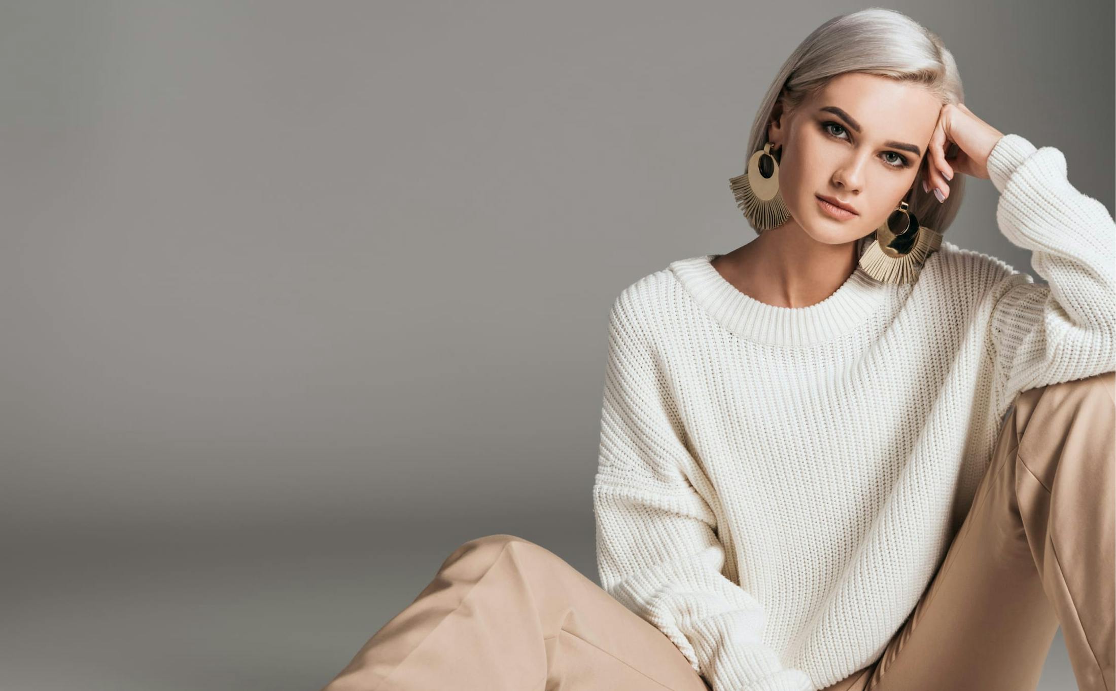 woman in a white sweater