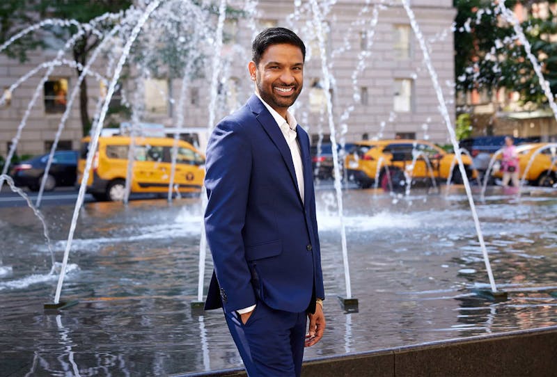 Dr. Singh infront of a fountain