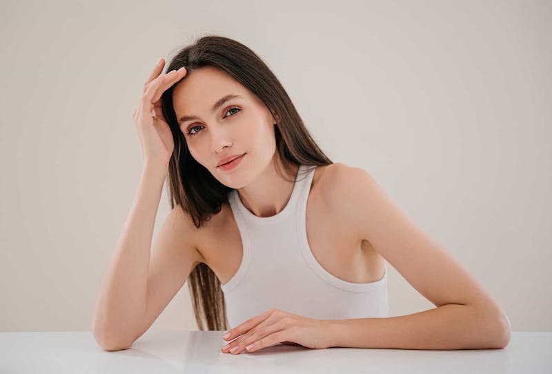 Woman leaning head on hand