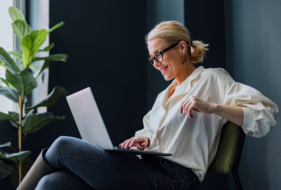 Woman on computer smiling