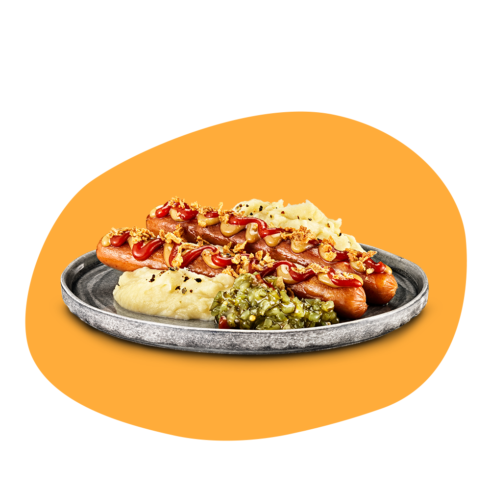 Tallrik med två vegokorvar med ketchup, senap, rostad lök plus potatismos och en klick bostongurka