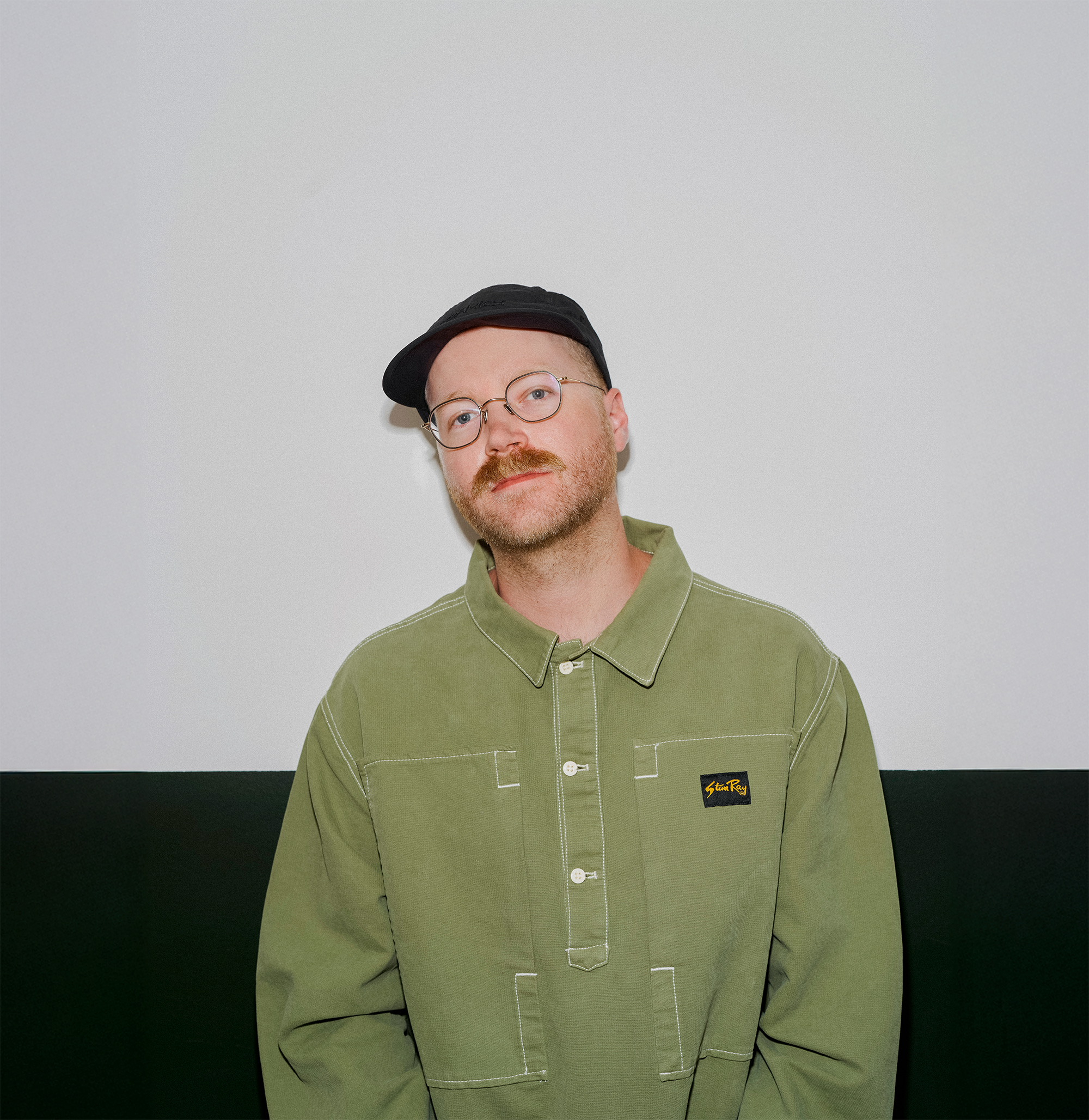 Portrait of Pier-Luc, co-founder of Domaine Public, wearing a green corduroy jacket