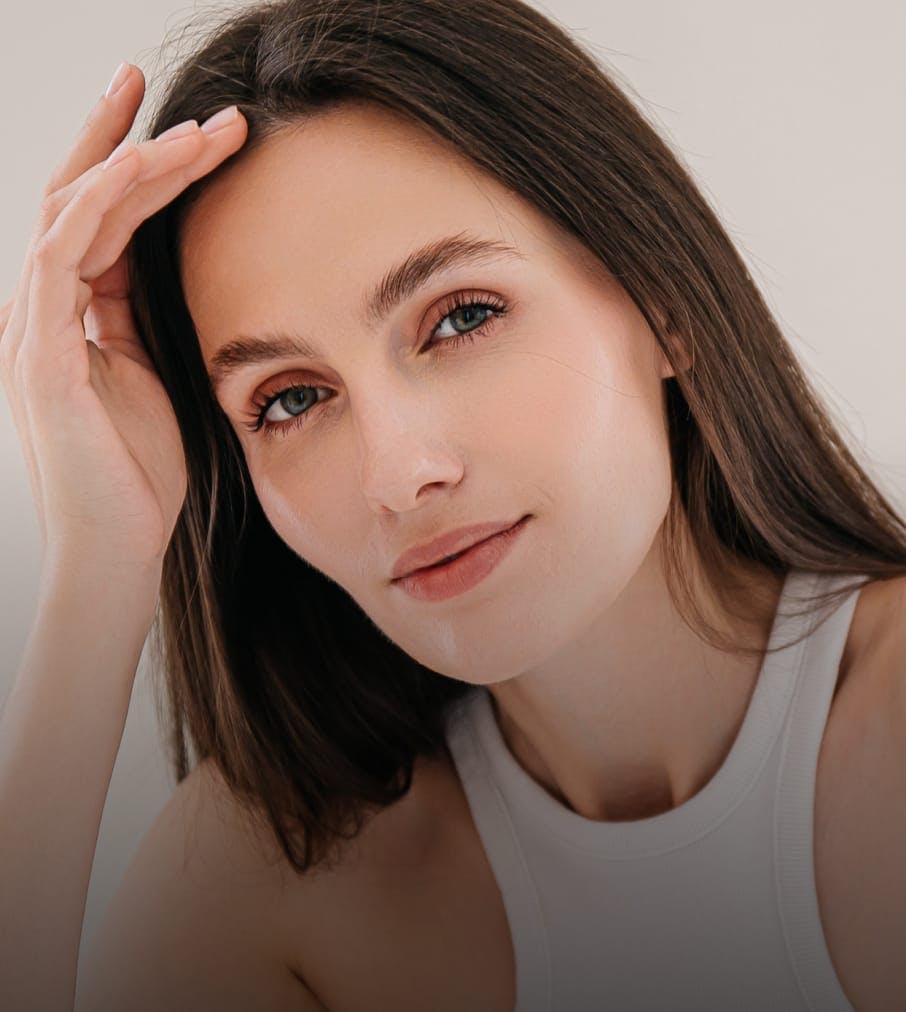 woman with clear skin and long brown hair