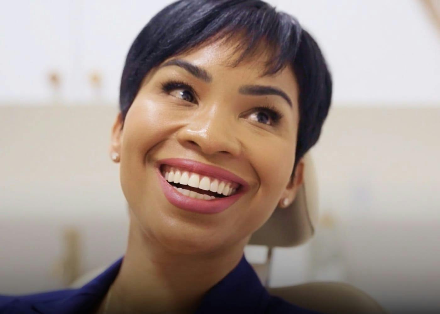 woman with a pixie haircut smiling