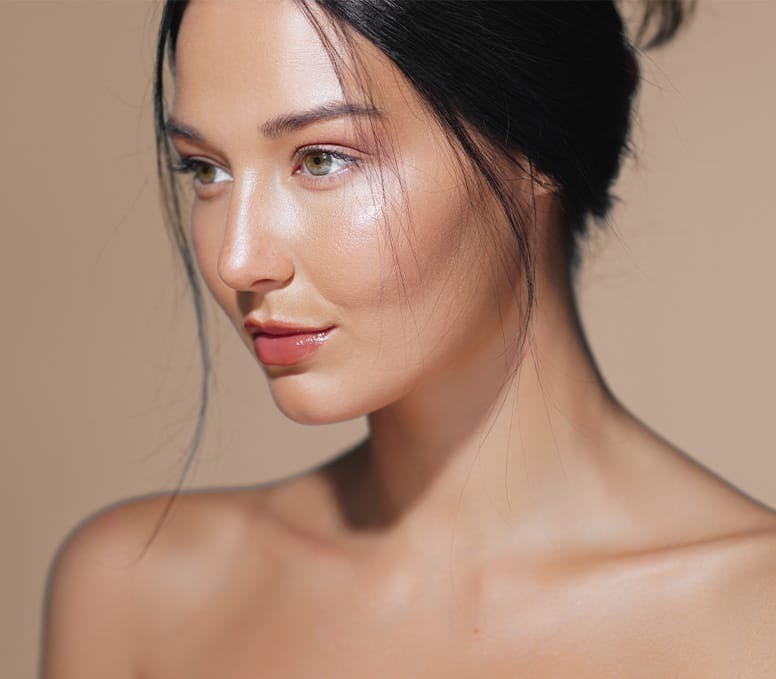 woman with her hair up looking to the left
