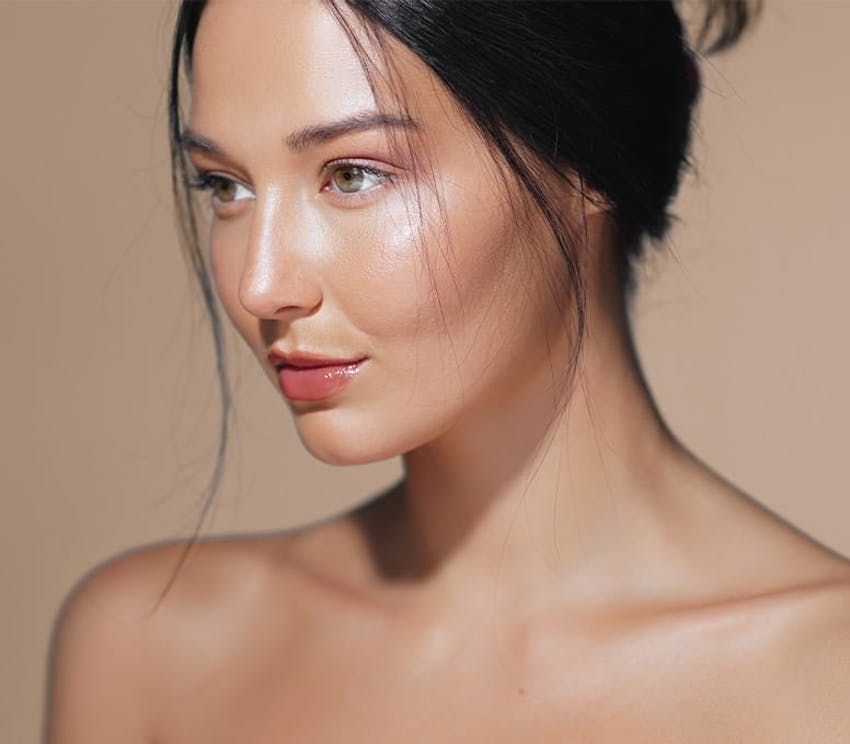 woman with her hair up looking to the left