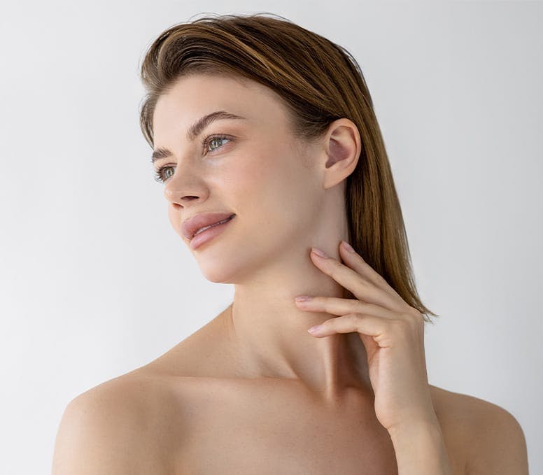 woman facing to the left with her fingers on her neck