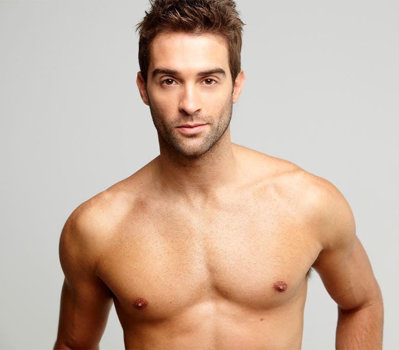man looking forward with his shirt off