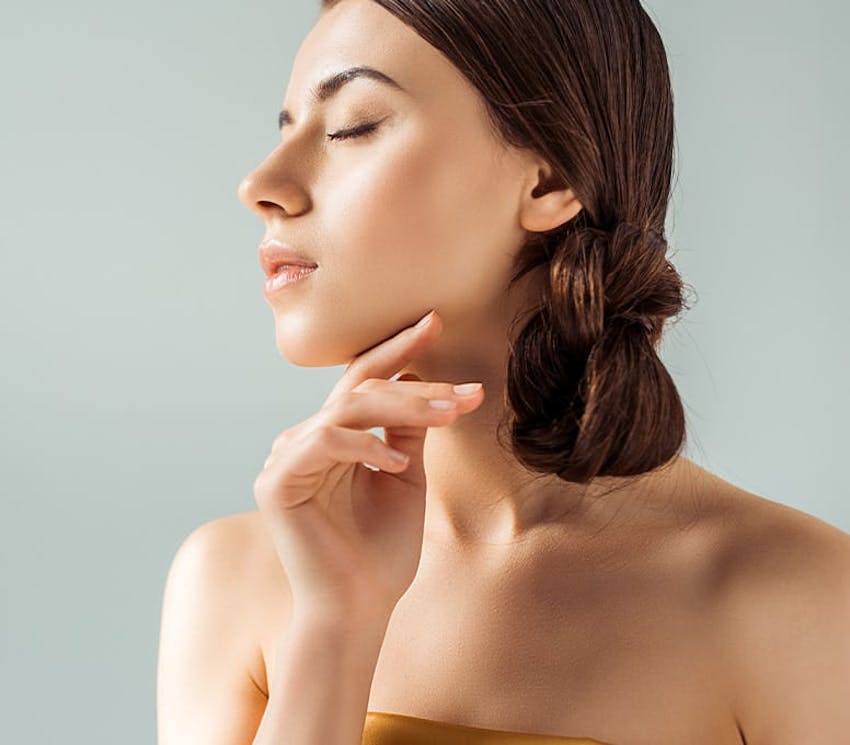 woman with her eyes closed and her hair tied