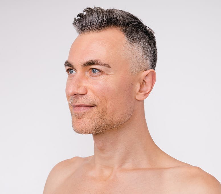 man with short haircut facing the left