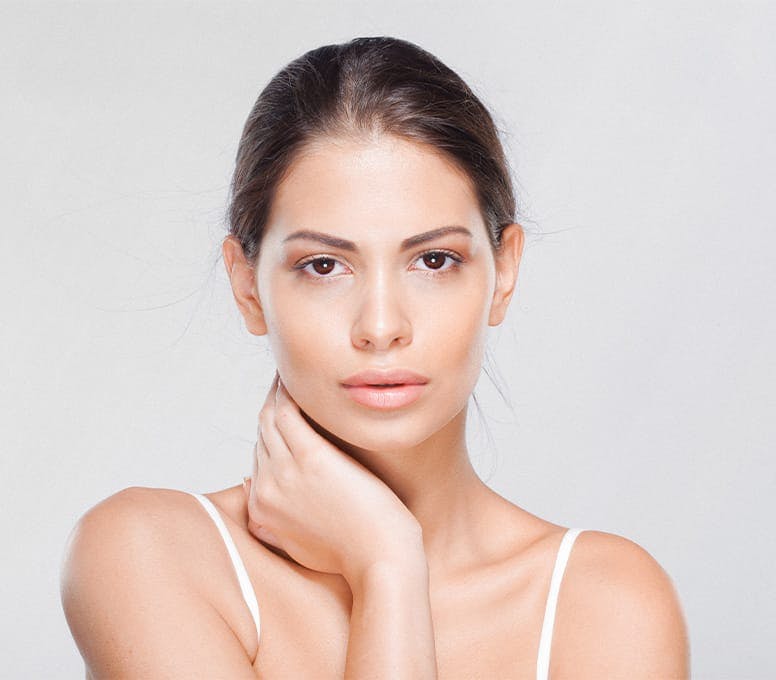 woman with hand on her neck
