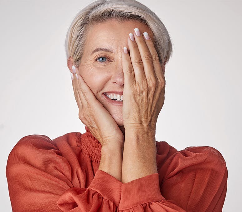 woman covering her eye with her hand