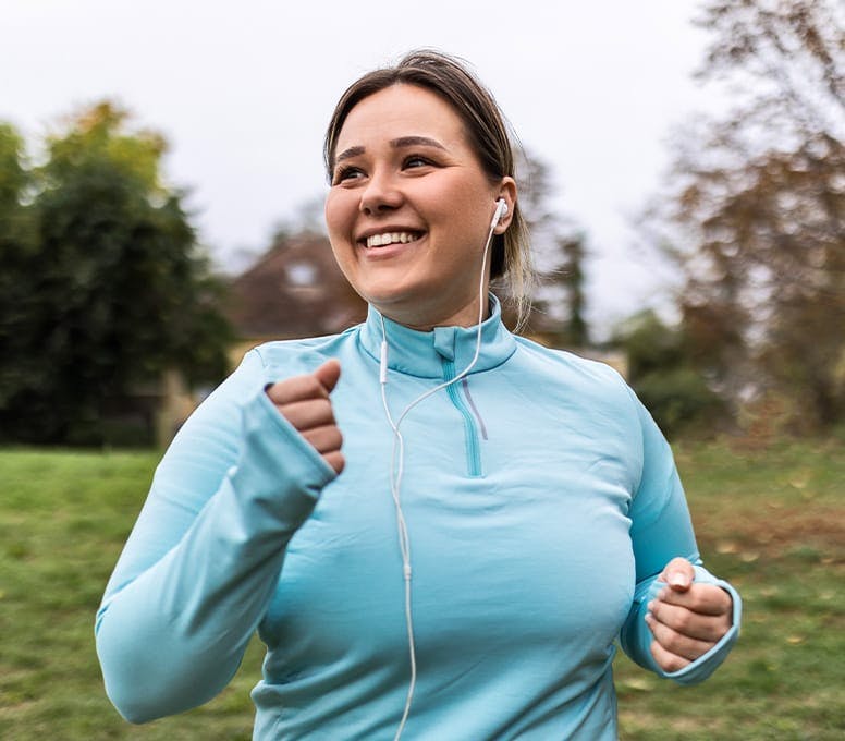 woman in blue jacket on a running