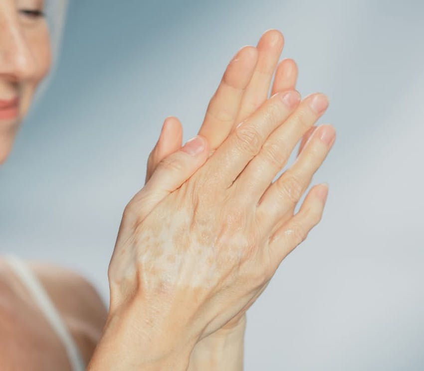 womans hands rubbing together