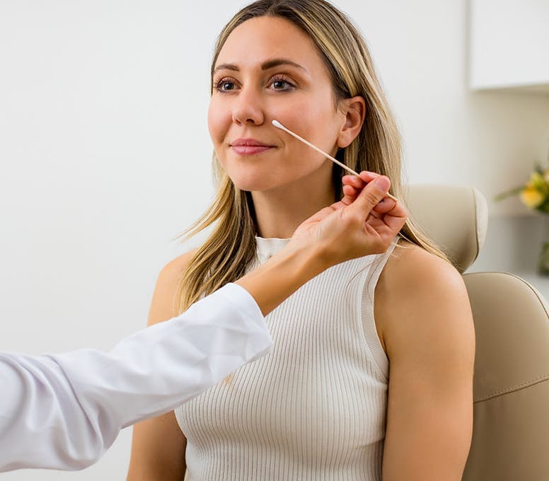 woman in exam chair getting examed