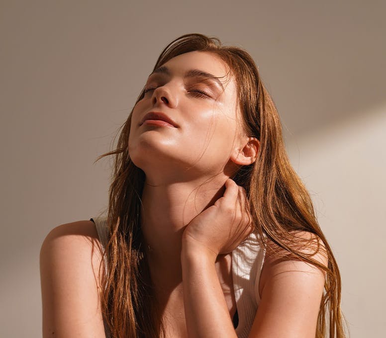 sun hitting woman on side of her face