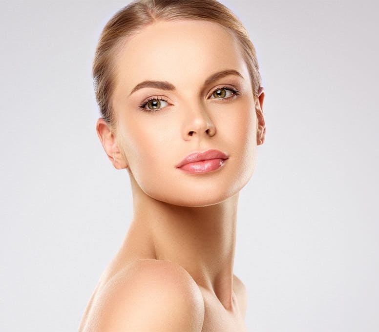woman with hair up looking forward