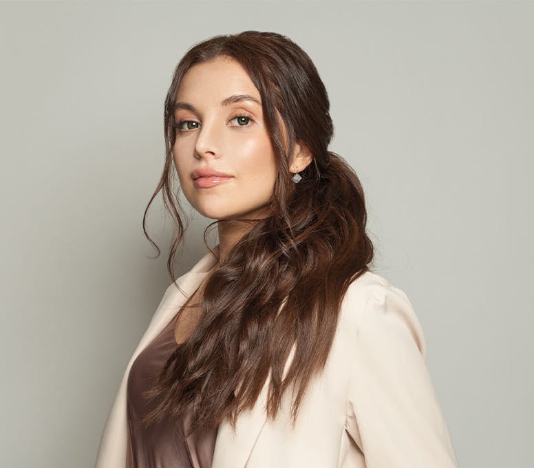 woman with long ponytail over her shoulder