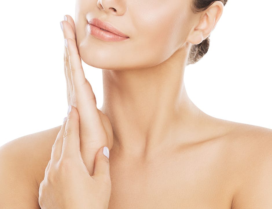 woman touching her jaw