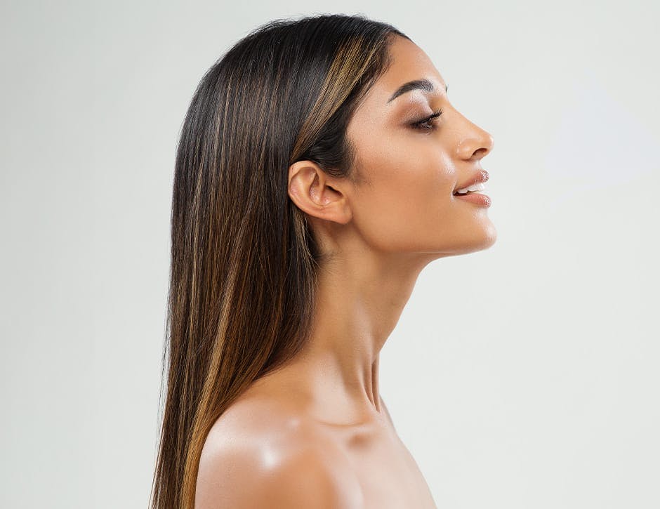 side profile of woman with long straight hair