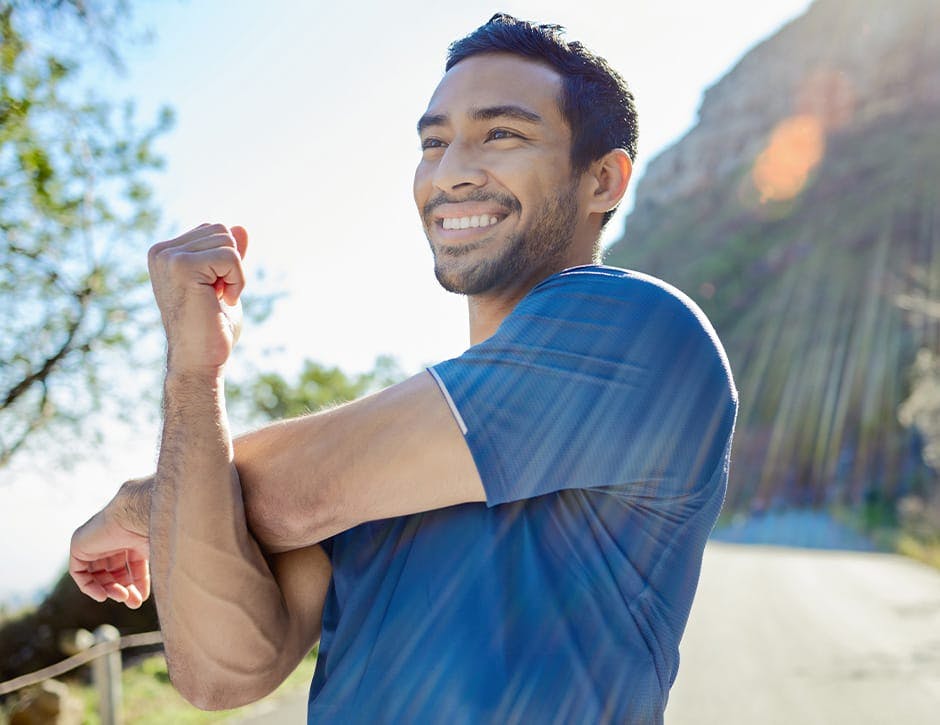 man stretching on a run
