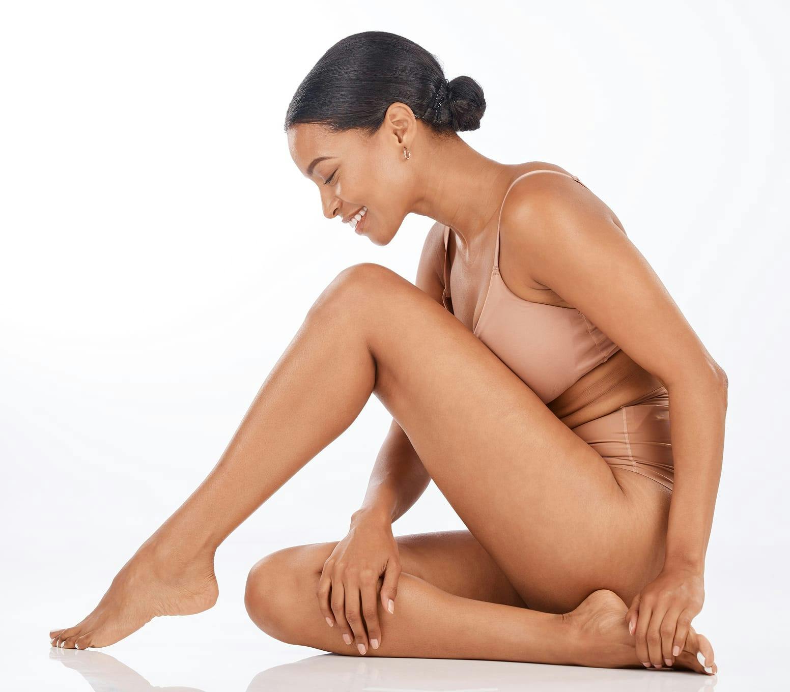 woman sitting with her leg bent
