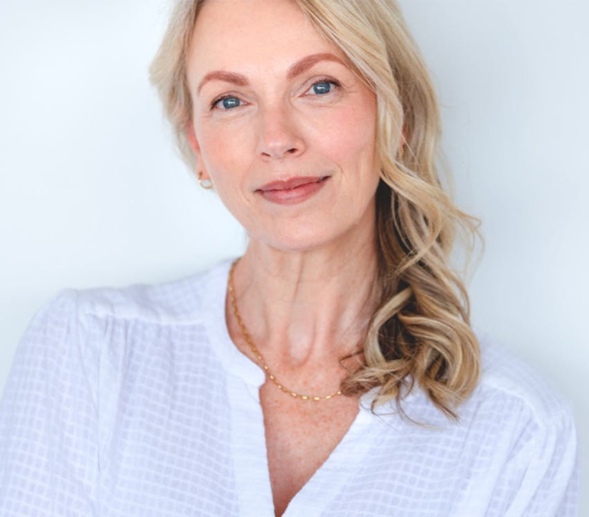 Smiling woman in white top