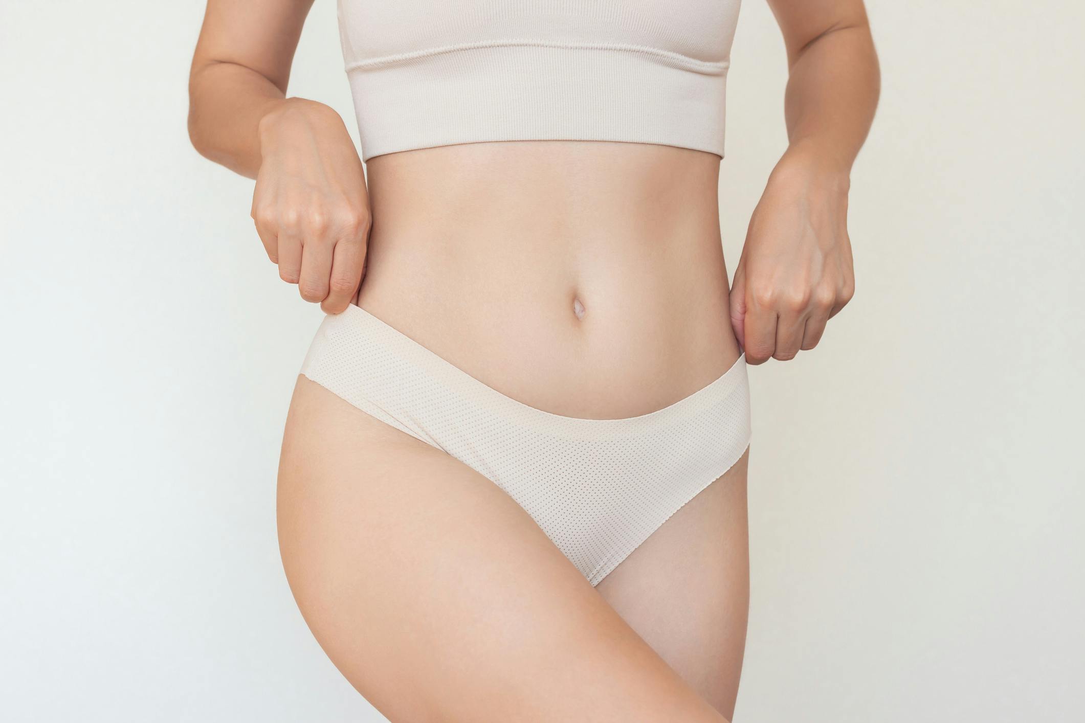 Woman holding the sides of her underwear