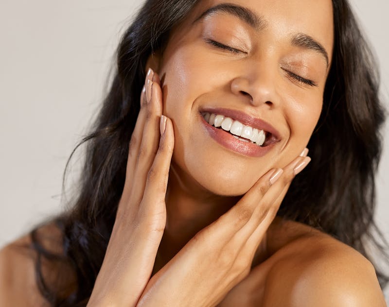 Woman touching her face