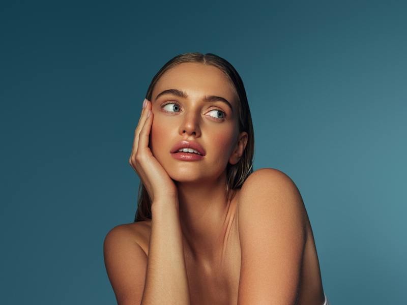 Woman looking up in studio shoot