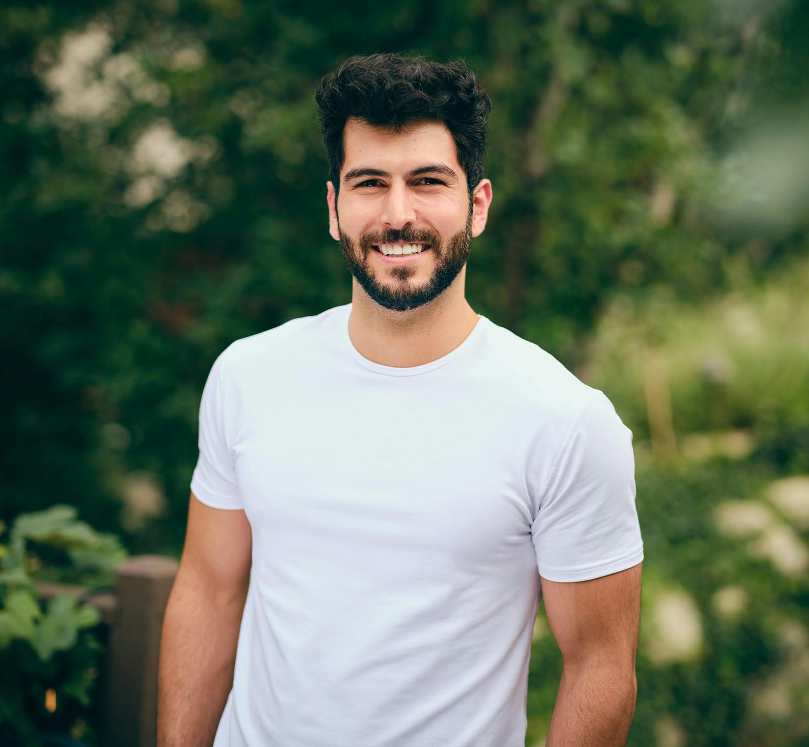 Bearded man in white shirt