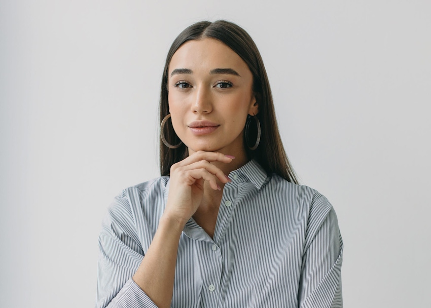 Woman in stgriped shirt smiling