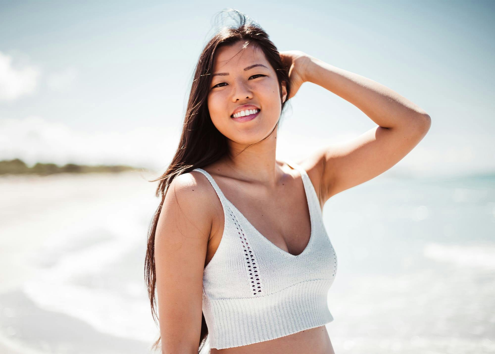 Woman in white top outdoors