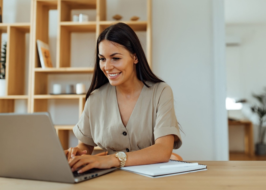 Woman typing on laptop