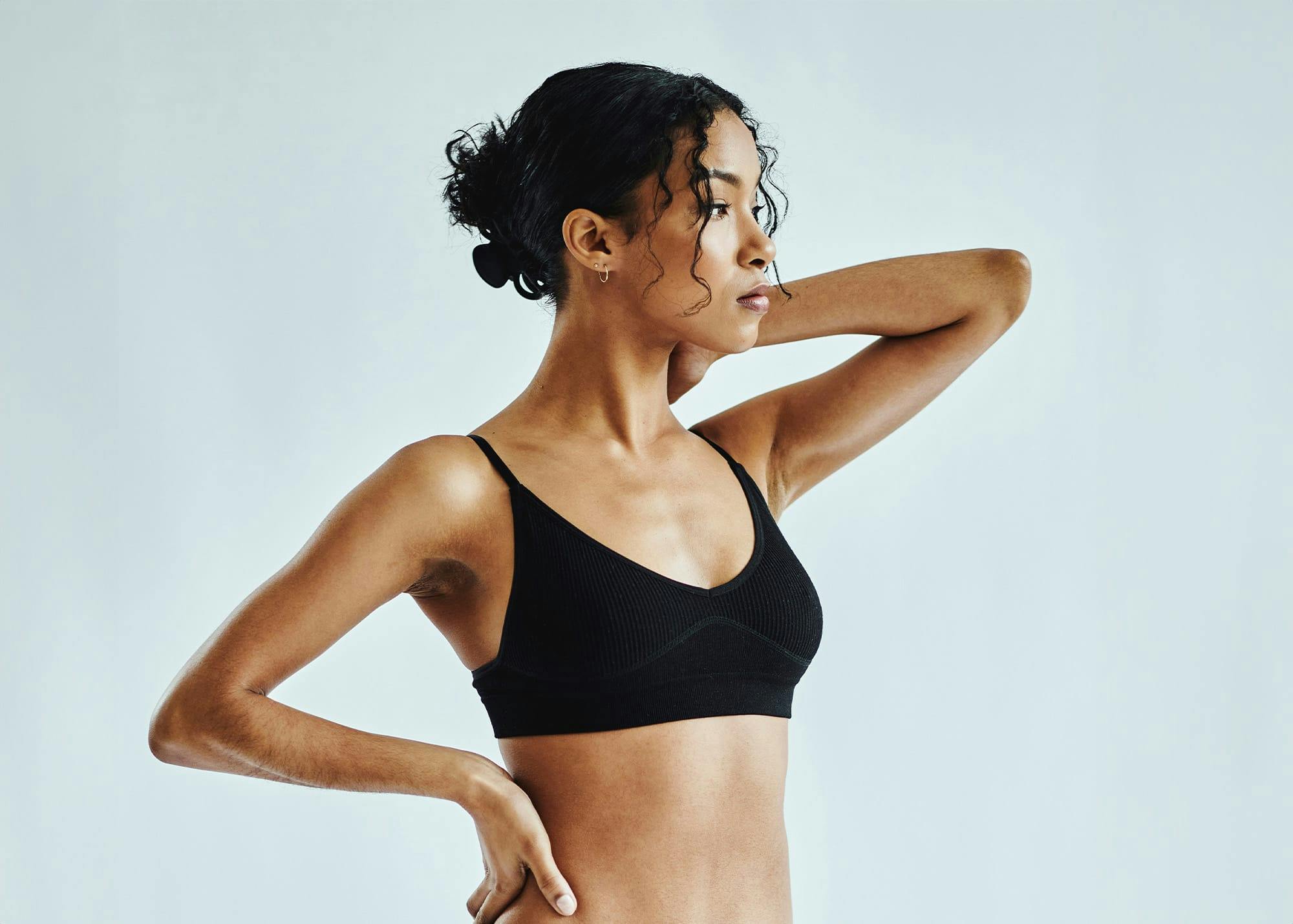 Woman posing in black bra